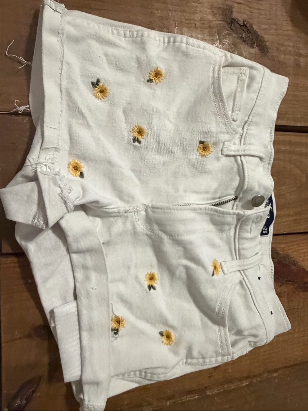 Hollister White Denim Shorts with Yellow Sunflower Embroidery